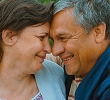 Smiling older man and woman outdoors